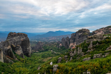 Fototapeta na wymiar Main observation deck of Meteora with panoramic view of smooth rock pinnacles formation and the Holy Eastern Orthodox Monasteries in Kalambaka, Meteora, Thessaly, Greece, Europe. Dramatic landscape