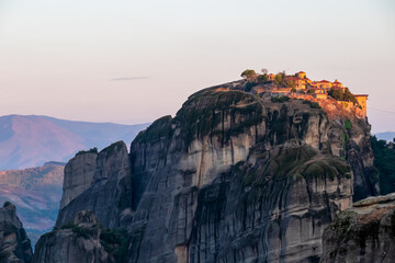 Scenic sunrise view of Holy Monastery of Great Meteoron (Meteoro Monastery, Megalo Meteoron) near Kalambaka, Meteora, Thessaly, Greece, Europe. Dramatic landscape. Orthodox landmark build on rock