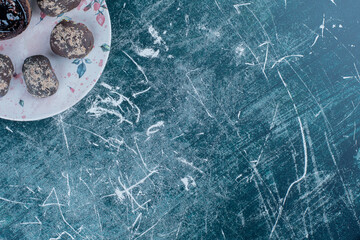 Chocolate muffins on the plate ,on the blue background