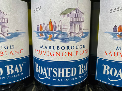 Viersen, Germany - Juin 9. 2022: Closeup of New Zealand Boatshed Bay cabernet sauvignon white wine bottles from Marlborough growing area in store shelf