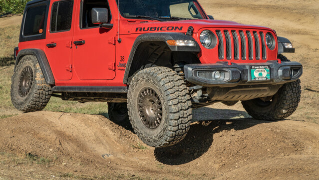 Loveland, CO, USA - August 27, 2022: Jeep Wrangler, Rubicon model,  on a dusty training drive off-road course.