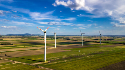 Fototapeta na wymiar Wind Farm With Wind Turbines In Agricultural Landscape in Austria