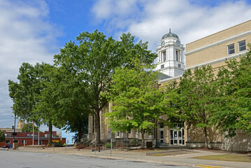 Fototapeta na wymiar Pitt County Courthouse (1910), historic courthouse building among green trees located at Greenville, Pitt County, North Carolina