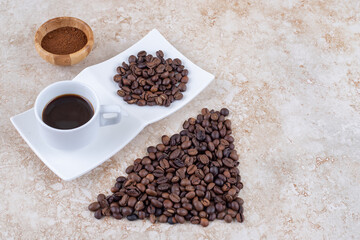 Various forms of coffee arranged on marble background