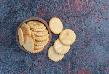 Biscuits in a small bowl on abstract background