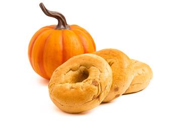 Line of Three Pumpkin Bagels Isolated on a White Background