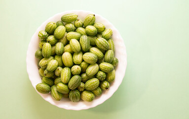 Cucamelon (Melothria scabra) - edible Mexican miniature watermelon - cucumber. Mini watermelon cucumbers have a delicious taste with sourness.