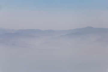view on peaks of Zagros mountains among clouds - obrazy, fototapety, plakaty