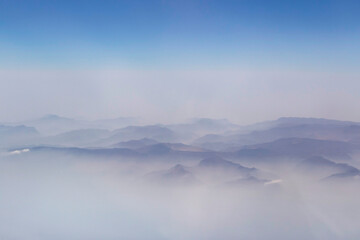 view on volcano and Zagros mountains among clouds - obrazy, fototapety, plakaty