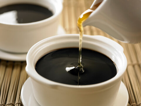 Herbal Jelly soup syrup served in a pot isolated on table side view