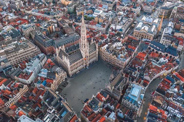 Raamstickers Sunset cityscape of the City of Brussels, Belgium: Aerial view of Grand Place square and Town Hall (Hôtel de Ville de Bruxelles) © uslatar