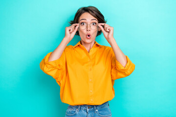 Photo of young pretty funny girl businesswoman wear yellow shirt pouted lips shock new eyeglasses unexpected isolated on cyan color background - obrazy, fototapety, plakaty