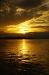 Horizon and sunlight at seaside after summer storm
