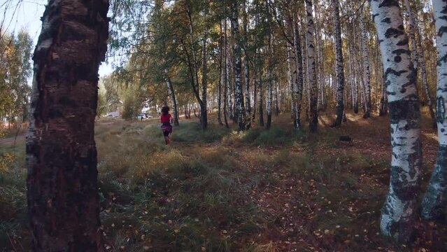 Shooting on a FPV drone orienteering competitions, an athlete on the orienteering track