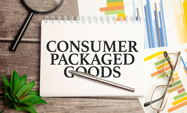 Notepad ,chart And Calculator. Top View Text CPG - Consumer Packaged Goods