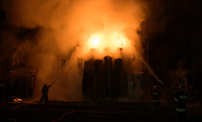 Fototapeta na wymiar Fire at a transformer substation after being hit by a missile 