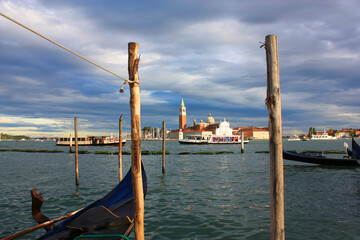 Fototapeta na wymiar Cityscapes with gondolas in front of San Giorgio Maggiore church in Venice, Italy 