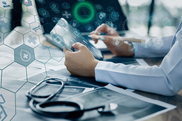 Medicine doctor using digital healthcare and network connection on hologram modern virtual screen...