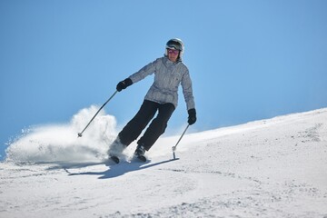 Skiing in the winter snowy slopes