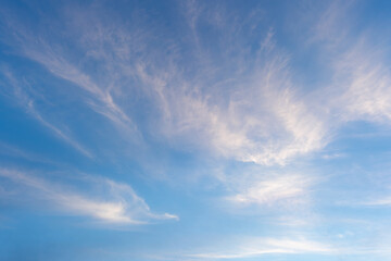 Photo of some white magenta clouds and blue sky cloudscape