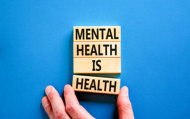 Mental health psychological symbol. Concept words Mental health is health on wooden blocks on a...