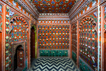 Obraz premium Rich decorated interior with painted flowers of the City Palace of Udaipuar, Rajasthan, India, Asia