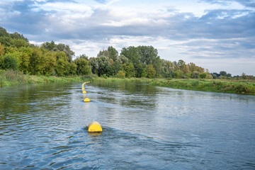 buoys marking the fairway on the Warta river in Ostrowsko, Poland - obrazy, fototapety, plakaty