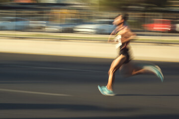 Running man with motion blur in the half marathon are running special for the 100th anniversary of Izmir's liberation.