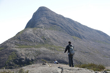 Mountaineer climbing brazil's highest peaks in the mountains with extensive hiking and backpacking.
