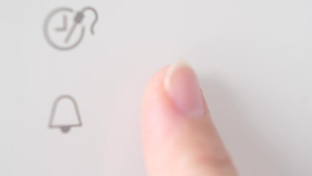 Human finger pressing a ok button