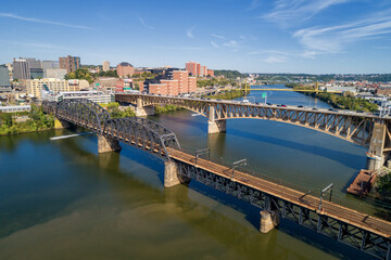 Obraz premium Pittsburgh Skyline with Downtown and Business District. Train Bridge and Liberty Bridge.