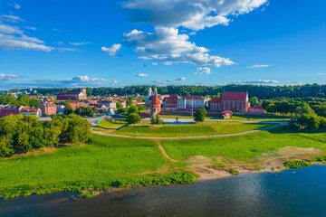 Landscape aerial photo of Kaunas old town. City town hall square with towers of churches, castle, cathedral and Neris river around