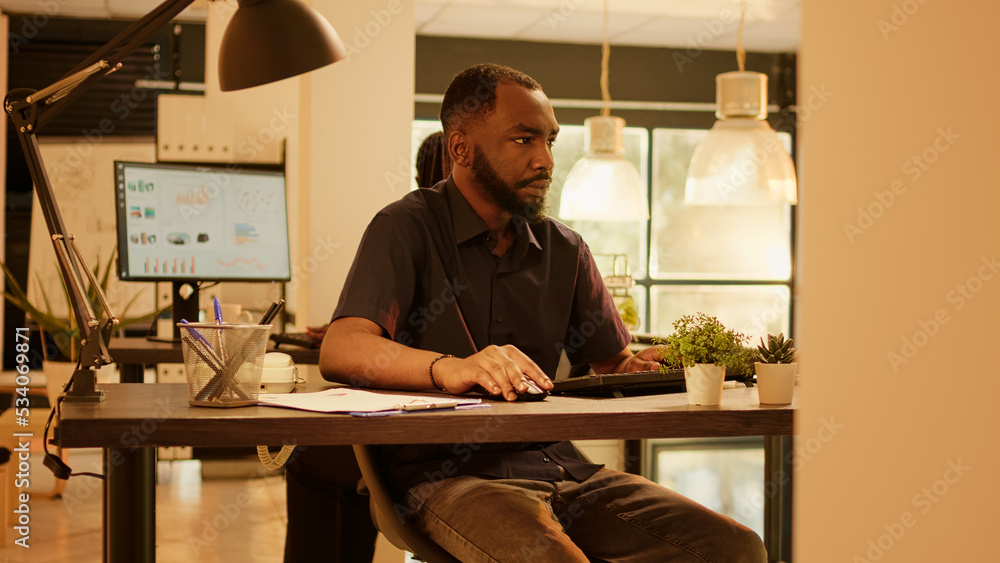 Aufkleber company employee working on presentation report at job, analyzing paperwork documents to create proj