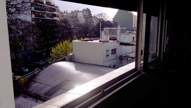 Rain while Sun Shines at the Same Time in Villa Crespo District, Buenos Aires, Argentina. 4K Resolution.