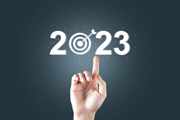 2023 and target icon on virtual screen.