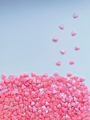 textured background, lots of small decorative candy pink hearts