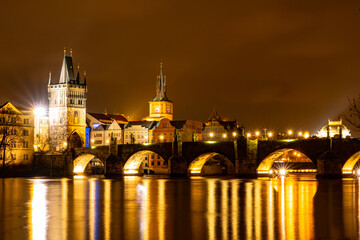 Fototapeta na wymiar Charles Bridge in Old Town, Prague, Czech Republic at night. Lights.