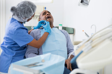 Dentist operates on patient - removes a bad tooth