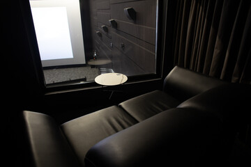 The interior of a private cinema booth in a public cinema.