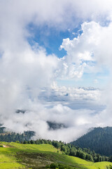 green mountain slopes. mountain landscape with clouds and green mountain slopes. daytime photo