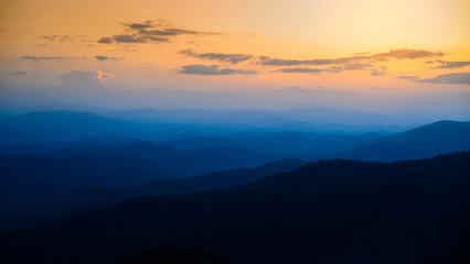 Fototapeta na wymiar Majestic blue mountains landscape in sunset sky with clouds ,Chiang mai ,Thailand