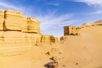 Eroded cliffs in the desert at Wadi el-Hitan paleontological site.
