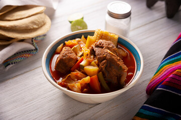 Mole de Olla. It is a balanced one pot meal, typical dish of the central region of Mexico, it is a beef stew broth based on beef and vegetables. It is consumed hot and accompanied with corn tortillas.