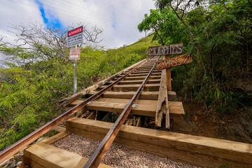 Bypass sign along the rail track of the Koko Crater Railway Trail in the suburbs of Honolulu on O'ahu island, Hawaii