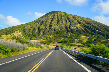 Road leading to the green slopes of the Koko Crater in the suburbs of Honolulu on O'ahu island in...