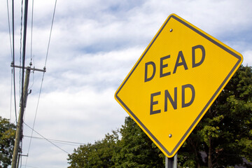 diamond street sign, symbol yellow black with text that reads Dead End