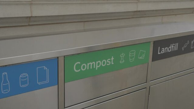 This video shows commercial recycling bins labeled "recycle", "compost", and "landfill".