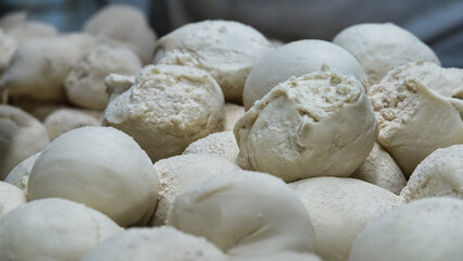 Fototapeta na wymiar Prepared dough balls for restaurant baking. Pizza, pita, dough balls