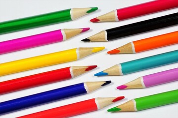 Background of colored pencils. School supplies for educational creativity.