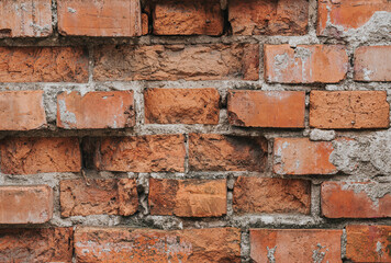 Old brick wall. Red bricks in a row background. Grunge texture